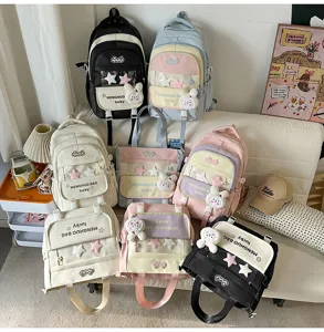 Stylish colorblock multi-compartment school backpack with clear pocket and plush pendant.