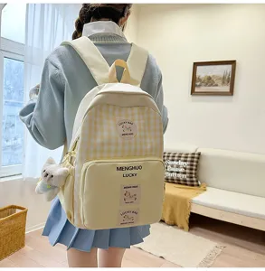 Japanese sweet yellow plaid school backpack for students, lightweight large capacity casual bag.