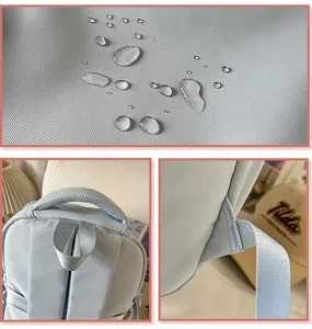 Waterproof fabric texture and reinforced strap details of light blue school backpack detail view.