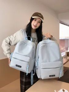 Sac à dos d'école bleu clair uni décontracté pour étudiants, élégant et léger pour les voyages.