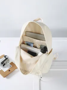 Sac à dos unie minimaliste pour femmes avec plusieurs compartiments de rangement intérieurs.