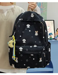 Cute black school backpack with white dog and star patterns, large capacity for students.