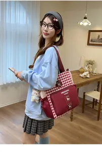 Detailed view of campus plaid shoulder bag with contrast color and front pocket for daily use.