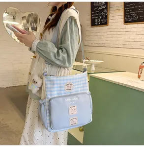 Student college style colorblock canvas crossbody shoulder bag with cute bear pendant.