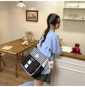 Casual canvas crossbody bag with plaid design, large capacity shoulder bag for students.