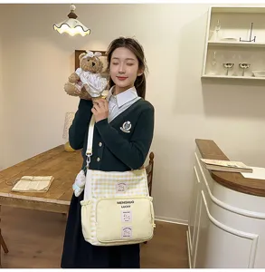 Canvas crossbody bag for women, cute yellow plaid shoulder bag with front pocket.