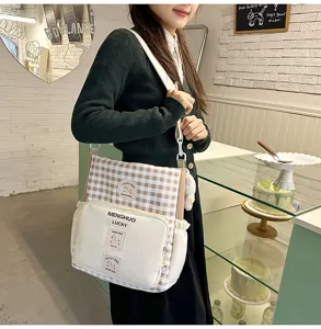 Student campus canvas crossbody shoulder bag with stylish plaid patchwork design for daily use.