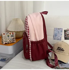Japanese sweet style school backpack with color block design, large capacity and dual pockets.