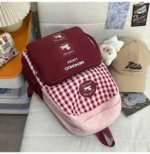 Japanese style sweet plaid school backpack for students, lightweight large capacity design.