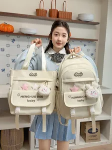 Cute canvas school backpack and tote bag set with plush bunny pendant and multi compartments.