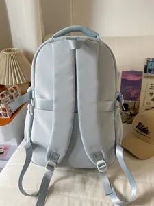 Light blue casual school backpack with double shoulder straps, large capacity for daily student use.