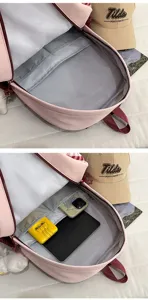 Detailed view of the pink student backpack showing its spacious interior and multiple compartments.