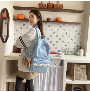 Korean style cute floral corduroy backpack for women, casual school bag with bear charm.