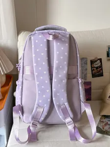 Sac à dos pastel violet mignon pour filles, design élégant avec pois et motif de cœur.