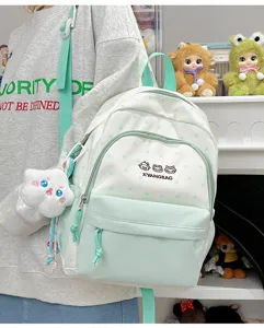 Mochila bonita verde menta y blanca con estrellas y bolsillo frontal para chicas.