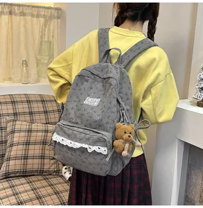 Grey corduroy backpack for women, cute bow print, school bookbag with lace trim and bear charm.