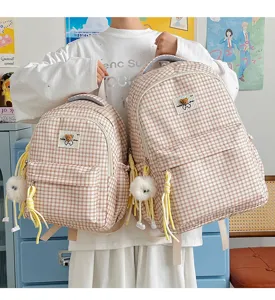 Cute plaid backpack for women, Japanese style school bag with bear pendant and large capacity.