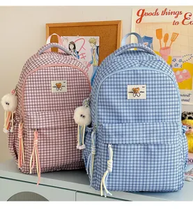 Sweet plaid backpack with cute bear patch and plush pendant, perfect for daily school use.