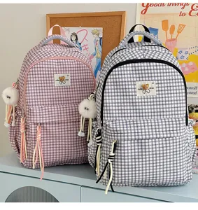 Cute Japanese ins style plaid school backpack for girls children daily travel and casual use.