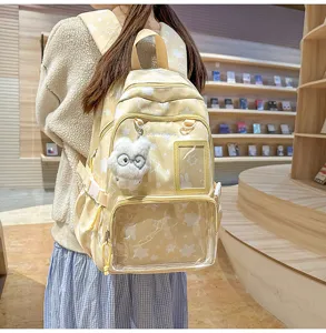 Japanese style cute star backpack student school bag with clear front pocket and plush doll pendant.