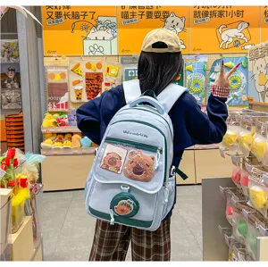Zaino ita azzurro chiaro carino con finestra trasparente e patch in peluche per studenti.