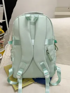 Casual green girls campus backpack, large capacity school bag with multiple straps and pockets.