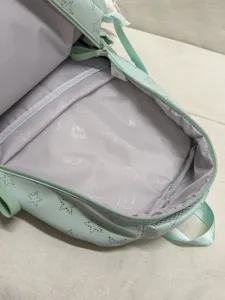 Light green school backpack for girls with star patterns and large capacity main compartment.