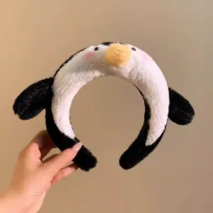 Cute plush penguin headband detail, soft fuzzy texture with adorable cartoon design for daily wear.