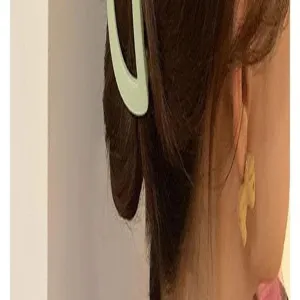 Detailed view of the elegant matte crescent hair claw clip worn on hair, showing back styling.