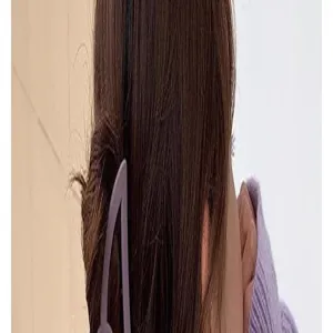 Detailed view of a stylish matte hair claw clip worn on brown hair, elegant accessory.