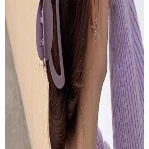 Detailed close-up shot of a purple frosted hair claw clip worn on hair back, elegant accessory.