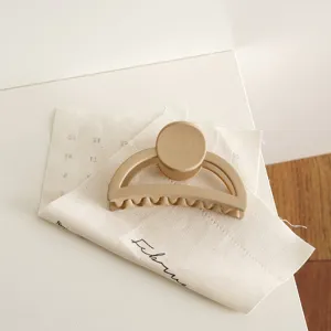 Matte milk coffee half-moon hair claw clip, elegant large geometric hair accessory for women.