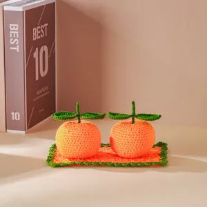 Handmade crochet orange car ornament detail shot, cute knitted fruit decor for auto interior.