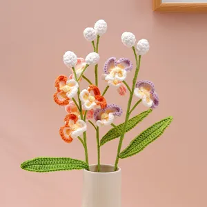 Handmade crochet phalaenopsis flower branch detail, multi-head yarn knit floral decor gift.