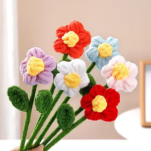 Handmade chunky yarn puff flower bouquet detail, colorful crochet floral decor for gifts.