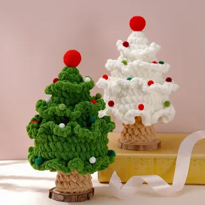 Handcrafted crochet Christmas tree detail shot, soft yarn holiday decoration with wood base.
