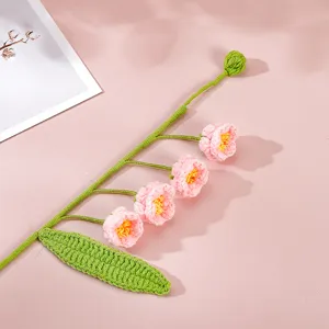 Handmade crochet pink flower branch detail, delicate yarn knit floral stem for home decor gift.