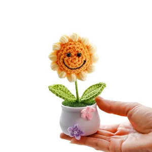 Handcrafted crochet sunflower potted plant, cute smiling flower decor for desk, car, or home gift.