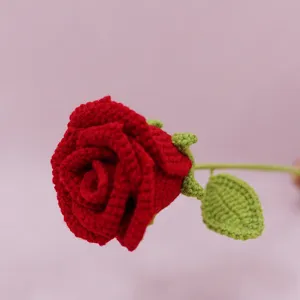 Handmade crochet red rose detail, knitted wool flower stem for home decor and gifts.