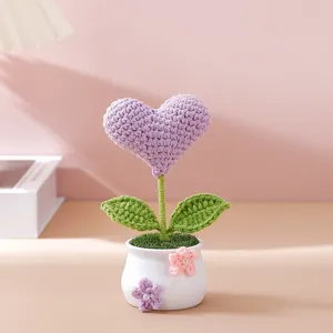 Handmade crochet purple heart flower potted plant detail, cute desktop decoration ornament.