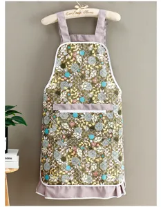 Floral print kitchen apron with front pocket and ruffle hem for cooking and gardening.