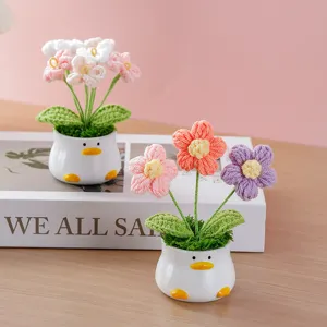 Handmade crochet flower potted plant with cute duck ceramic vase for home desktop decor.