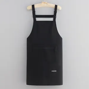 Professional black kitchen apron with zipper pocket adjustable straps for cooking and work use.