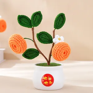 Handmade crochet kumquat potted plant details, festive home decor for Chinese New Year.