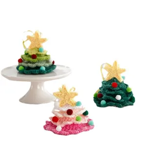 Handcrafted crochet Christmas tree ornaments with cute star toppers and colorful pom poms.