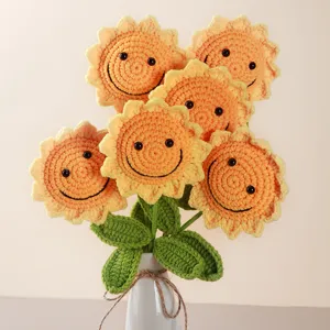 Handcrafted crochet sunflower bouquet detail, cute smiling knitted flower home decor.