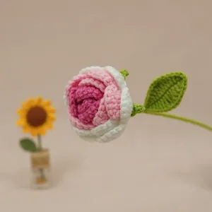 Handcrafted crochet gradient rose flower, delicate single stem decor for home and tabletop detail view.