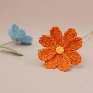 Handmade crochet cosmos wool flower detail showing exquisite knitting texture and vibrant colors.