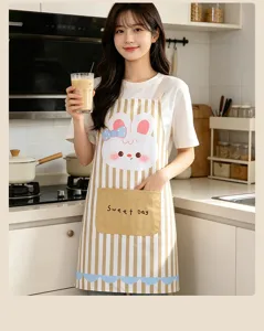 Detailed view of the cute cartoon rabbit printed linen apron in a bright modern kitchen.