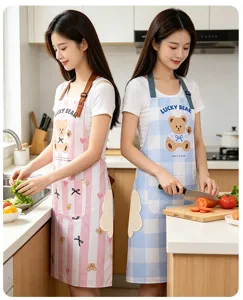 Kitchen apron detail showing waterproof fabric, cute bear print, and side hand-drying towel.